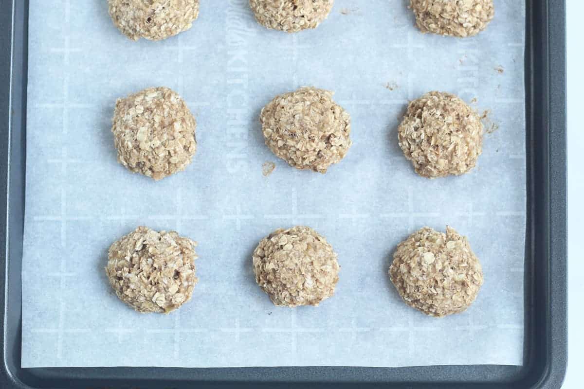 baked baby cookies on parchment lined sheet pan