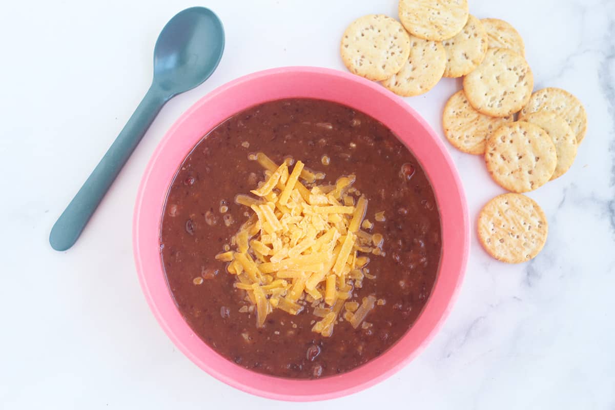 bowl of slow cooker black bean soup with crackers.