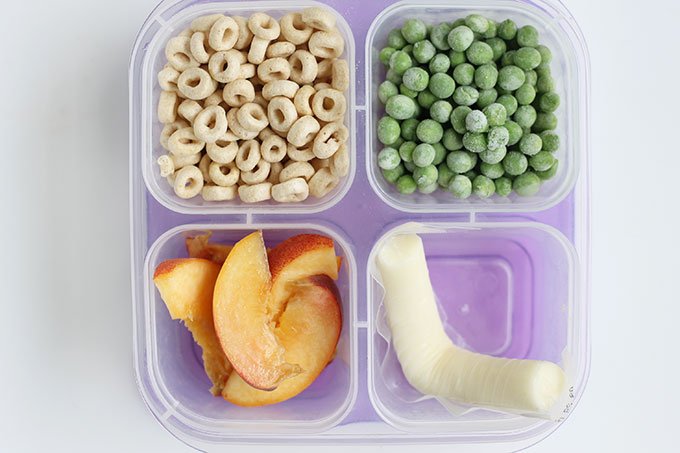 kids bento box for kindergarten with cereal, peas, cheese