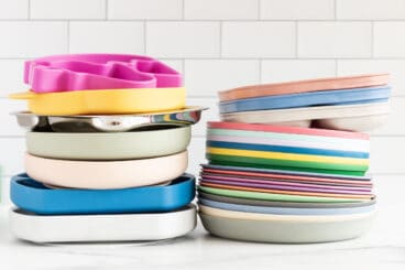 stack of kids plates on countertop.