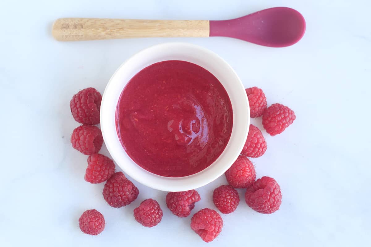 raspberry-puree-in-white-bowl-with-berries
