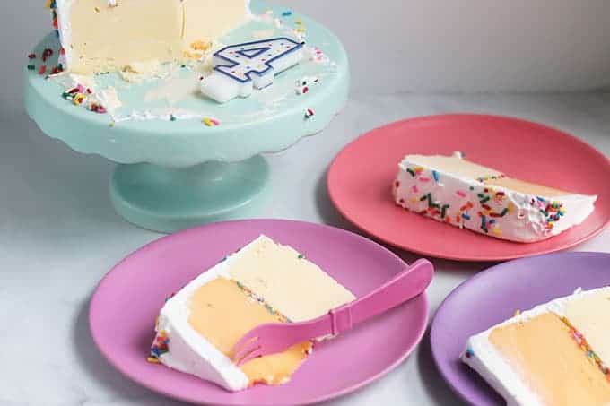 sliced-ice-cream-cake on pink plates