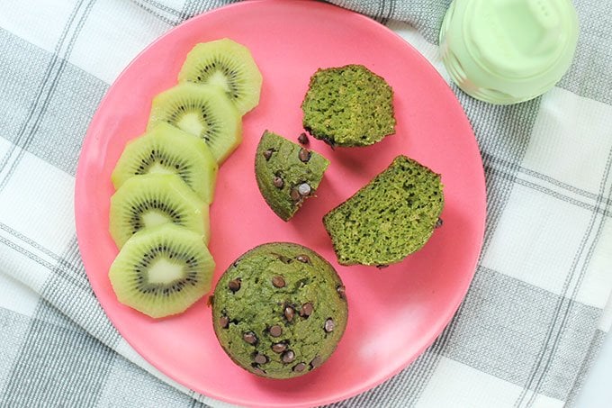 spinach muffins on a plate with fruit