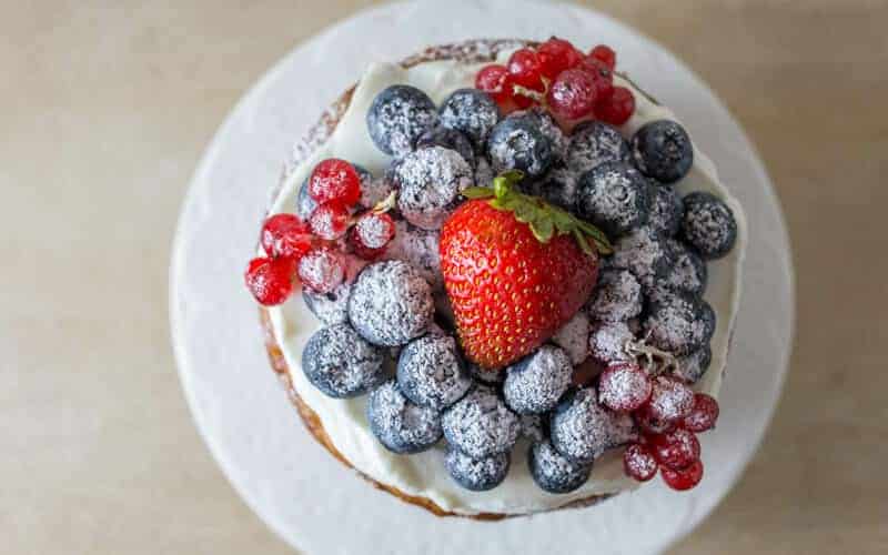 healthy first birthday cake with oats and berries on top