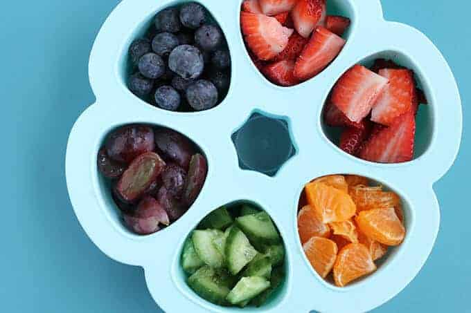 toddler breakfast idea precut fruit in blue storage container