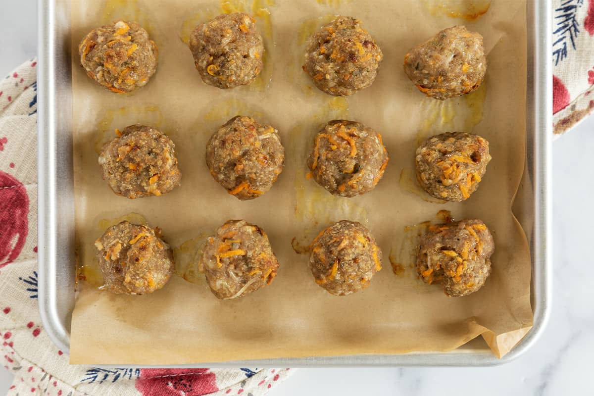 Turkey meatballs after cooking on baking pan.