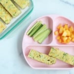 Zucchini slice with veggies on pink kids plate
